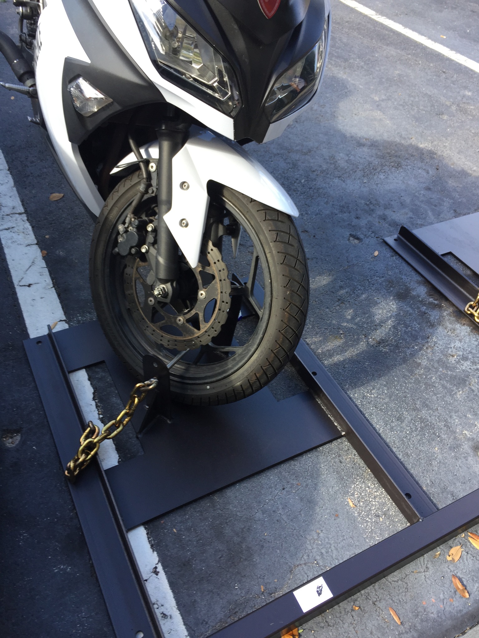 Motorcycle secured in MotoKeep Rack System